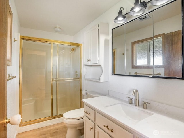 2 W Johnson Ln, Lind, WA 99341 - full bathroom featuring vanity, a shower stall, and wood finished floors