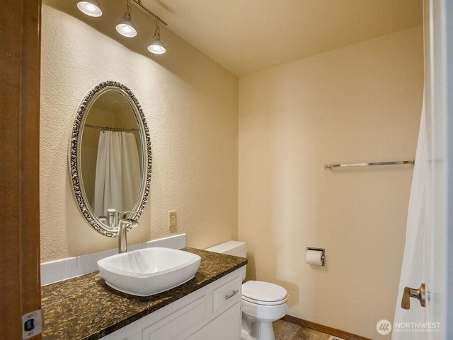 2 W Johnson Ln, Lind, WA 99341 - full bathroom featuring vanity and a textured wall