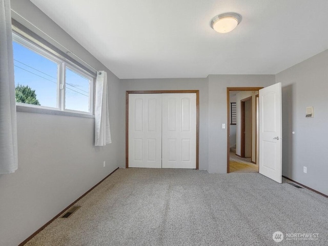 2 W Johnson Ln, Lind, WA 99341 - unfurnished bedroom with a closet and carpet flooring