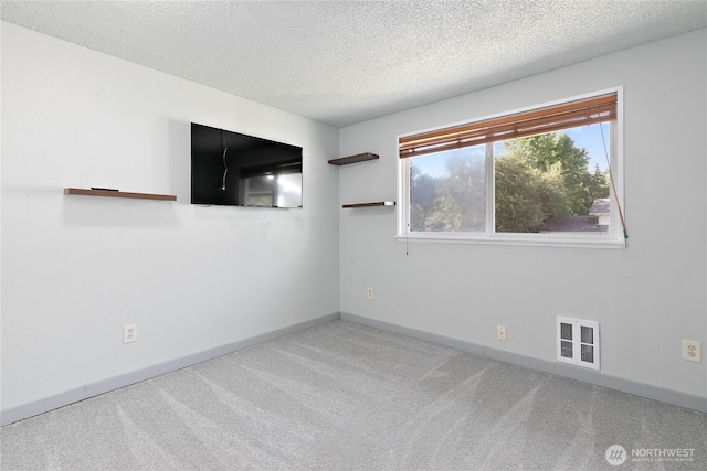 5701 38th Ct SE, Lacey, WA 98503 - spare room featuring carpet flooring and a textured ceiling
