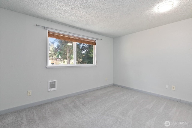5701 38th Ct SE, Lacey, WA 98503 - unfurnished room with carpet flooring, a textured ceiling, and heating unit