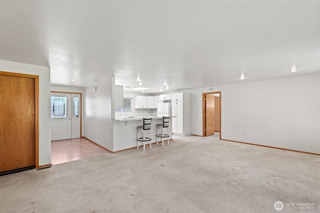 19214 Lakeview Dr, Soap Lake, WA 98851 - unfurnished living room with light carpet and baseboards