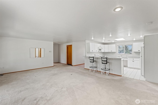 19214 Lakeview Dr, Soap Lake, WA 98851 - unfurnished living room featuring light colored carpet and recessed lighting