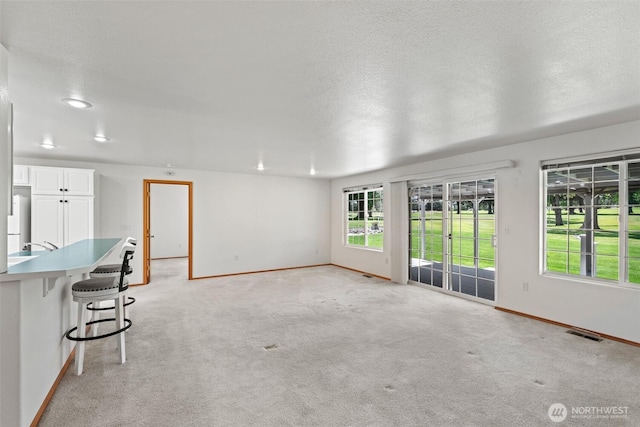 19214 Lakeview Dr, Soap Lake, WA 98851 - unfurnished living room with light colored carpet