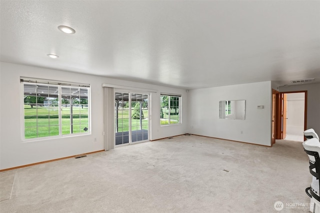 19214 Lakeview Dr, Soap Lake, WA 98851 - unfurnished living room featuring light colored carpet and baseboards