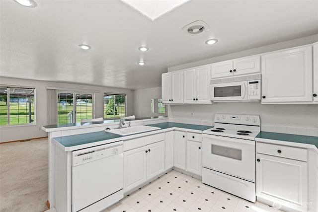 19214 Lakeview Dr, Soap Lake, WA 98851 - kitchen with white appliances, a peninsula, white cabinets, recessed lighting, and open floor plan