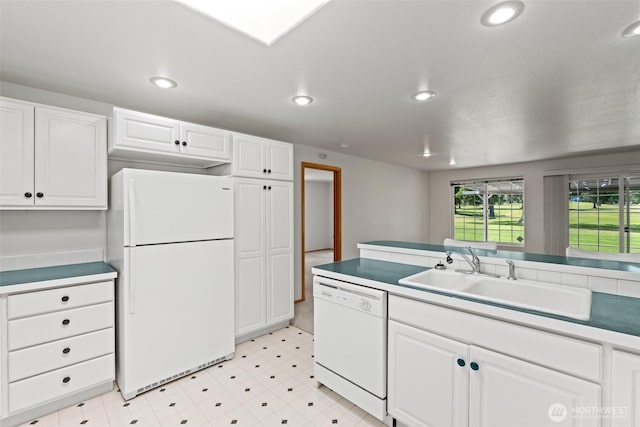 19214 Lakeview Dr, Soap Lake, WA 98851 - kitchen featuring white appliances, light floors, white cabinetry, recessed lighting, and light countertops