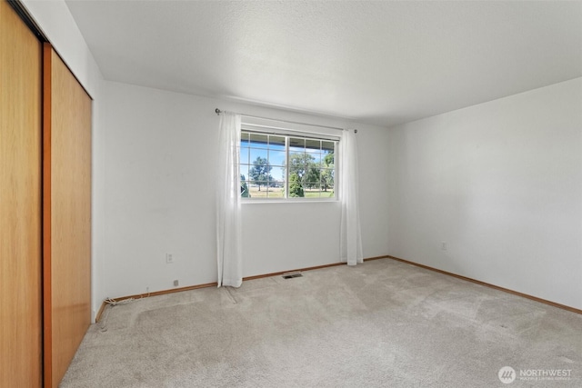 19214 Lakeview Dr, Soap Lake, WA 98851 - unfurnished bedroom with light colored carpet and a closet
