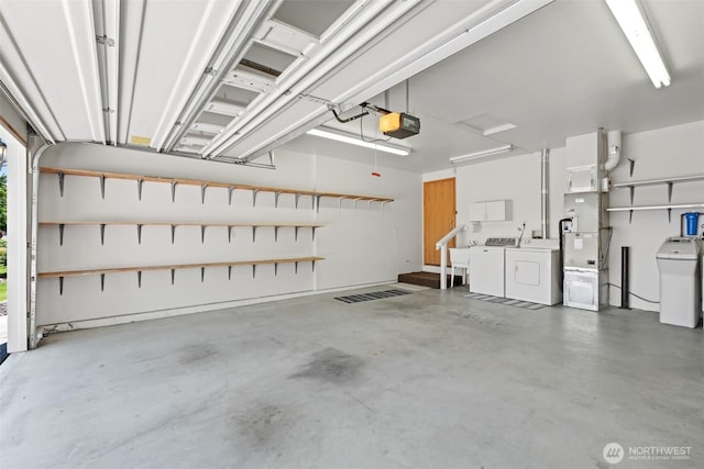 19214 Lakeview Dr, Soap Lake, WA 98851 - garage with washer and dryer, a garage door opener, and heating unit