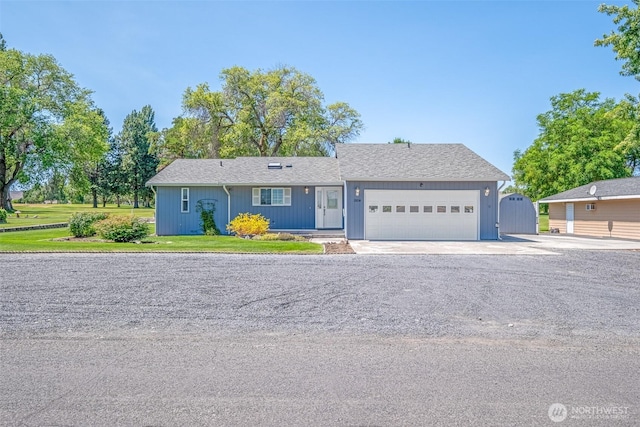 19214 Lakeview Dr, Soap Lake, WA 98851 - view of front of property featuring an attached garage, a gate, driveway, and a front yard