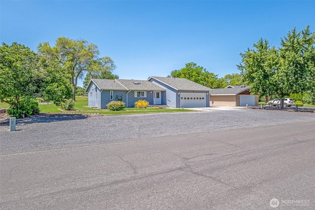 19214 Lakeview Dr, Soap Lake, WA 98851 - view of front of home featuring an attached garage, a front yard, and driveway