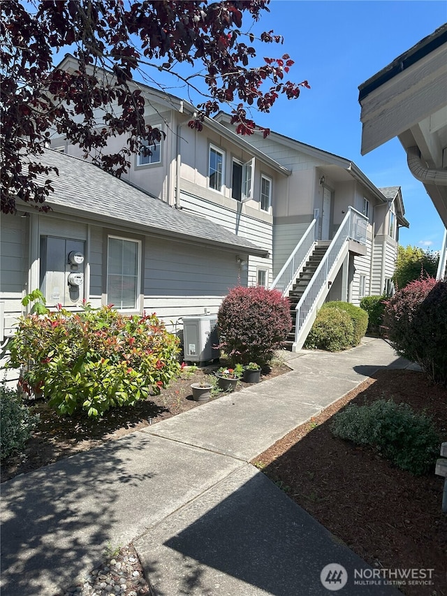 515 W Kellogg Rd, Bellingham, WA 98226 - view of side of property with stairway and a shingled roof