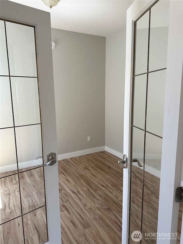 515 W Kellogg Rd, Bellingham, WA 98226 - unfurnished bedroom with wood finished floors and baseboards
