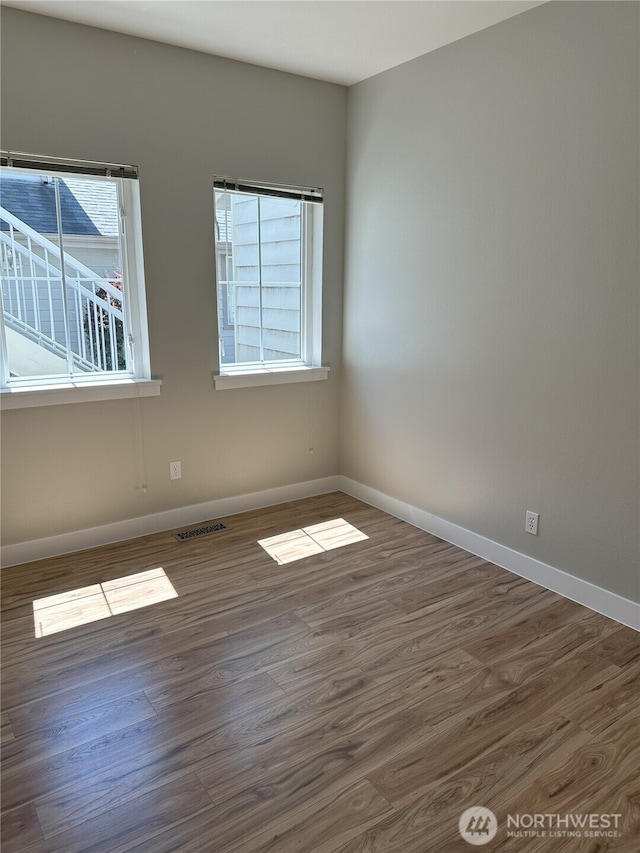 515 W Kellogg Rd, Bellingham, WA 98226 - unfurnished room featuring healthy amount of natural light and wood finished floors