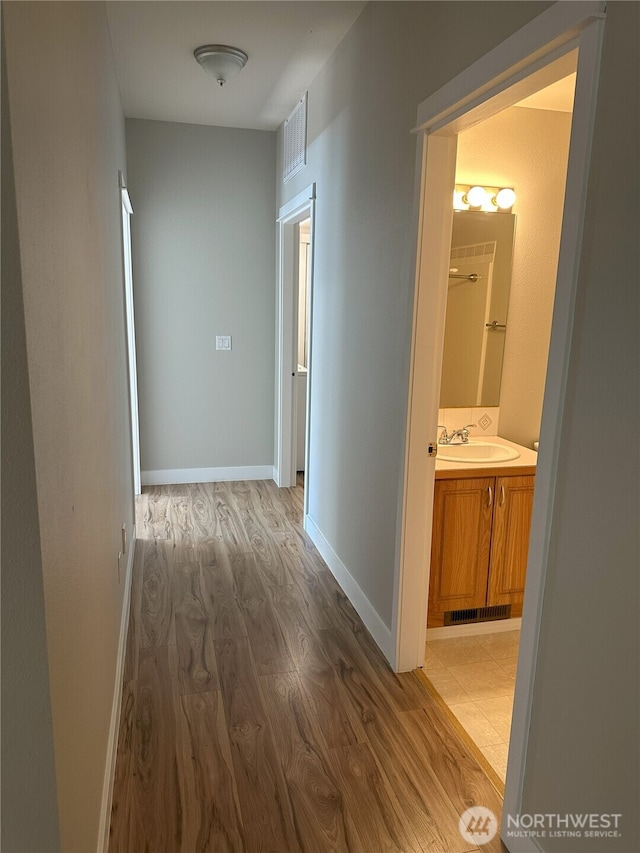 515 W Kellogg Rd, Bellingham, WA 98226 - hall featuring light wood finished floors and a sink