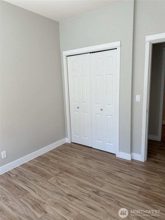 515 W Kellogg Rd, Bellingham, WA 98226 - unfurnished bedroom featuring light wood-type flooring and a closet