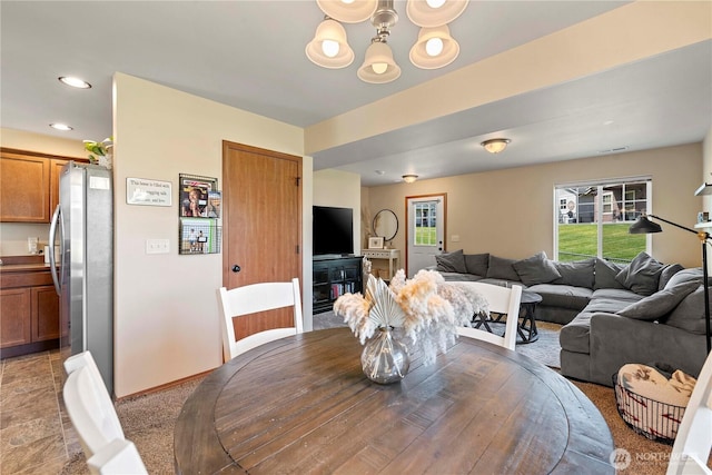 300 Saddlehorn Ln, Wenatchee, WA 98801 - dining space with a chandelier and baseboards