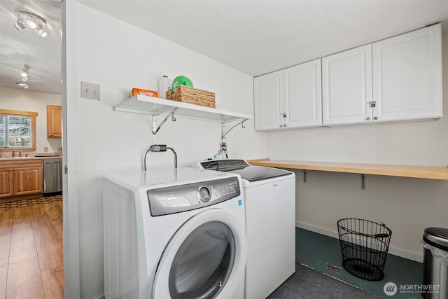 1313 Front St, Leavenworth, WA 98826 - washroom with washing machine and clothes dryer and light wood-style flooring