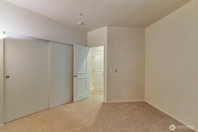 3924 243rd Pl SE Unit G204, Bothell, WA 98201 - unfurnished bedroom featuring light colored carpet and a closet