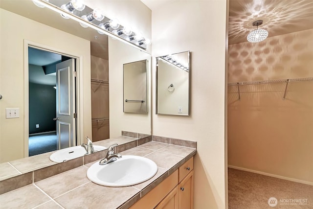3924 243rd Pl SE Unit G204, Bothell, WA 98201 - bathroom featuring vanity and a walk in closet