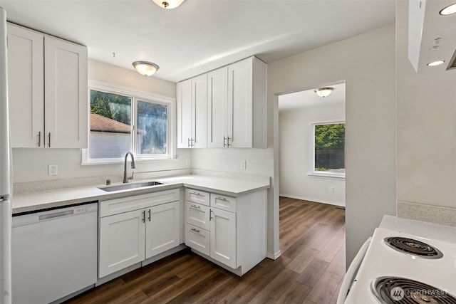 3154 Pear St SE, Olympia, WA 98501 - kitchen with white appliances, dark wood-style floors, white cabinetry, and light countertops