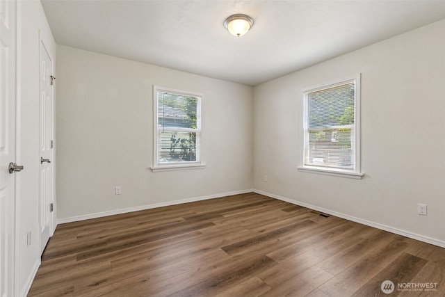 3154 Pear St SE, Olympia, WA 98501 - unfurnished bedroom with wood finished floors and baseboards