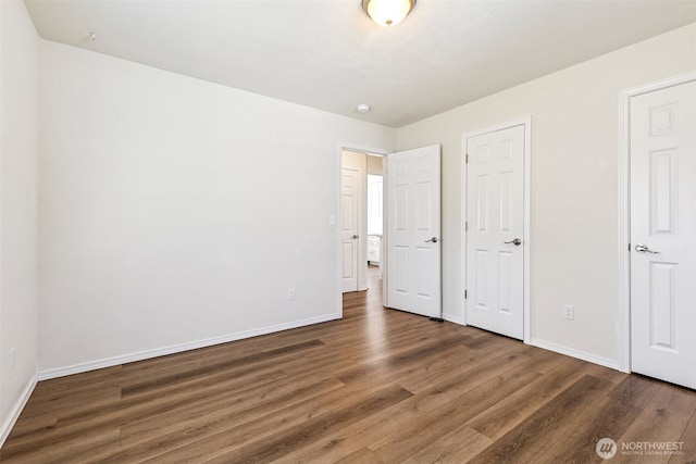 3154 Pear St SE, Olympia, WA 98501 - unfurnished bedroom with wood finished floors and baseboards