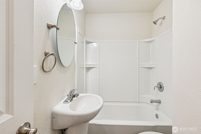 3154 Pear St SE, Olympia, WA 98501 - bathroom featuring tub / shower combination and a textured wall