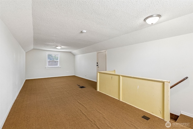 3154 Pear St SE, Olympia, WA 98501 - bonus room featuring vaulted ceiling, carpet, and a textured ceiling