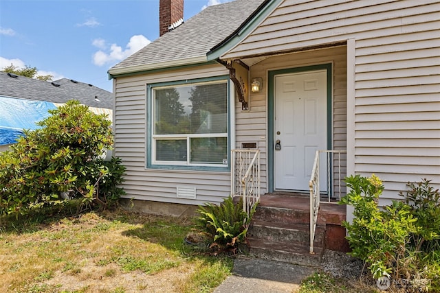 3154 Pear St SE, Olympia, WA 98501 - property entrance with a chimney and roof with shingles