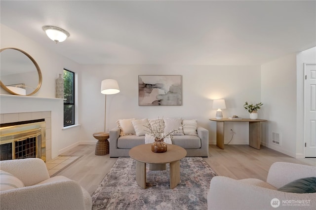 25015 110th Ave SE Unit B, Kent, WA 98030 - living area featuring wood finished floors and a fireplace