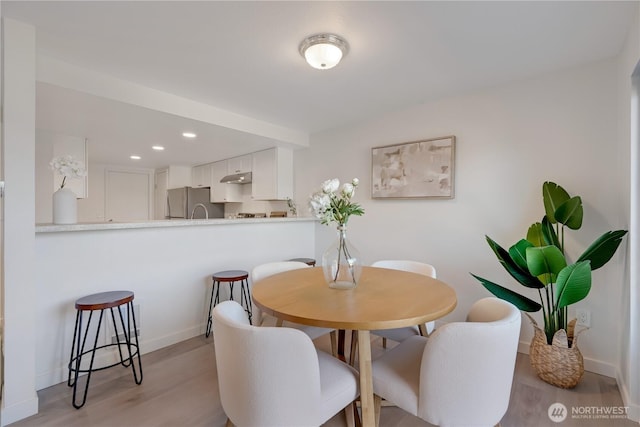 25015 110th Ave SE Unit B, Kent, WA 98030 - dining room featuring light wood finished floors and recessed lighting
