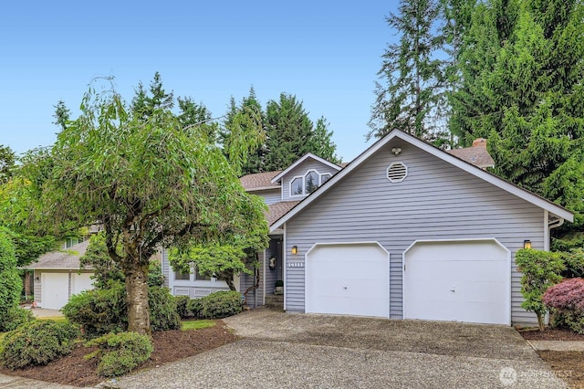 14111 NE 63rd Ct, Redmond, WA 98052 - view of front of property featuring concrete driveway, a garage, and a shingled roof
