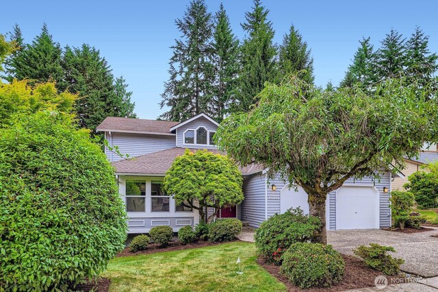 14111 NE 63rd Ct, Redmond, WA 98052 - view of front of home featuring gravel driveway and roof with shingles