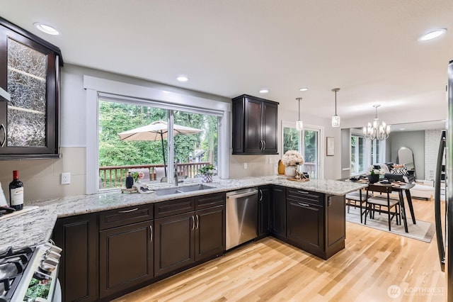 14111 NE 63rd Ct, Redmond, WA 98052 - kitchen with dishwasher, light wood-style flooring, a chandelier, range, and a peninsula