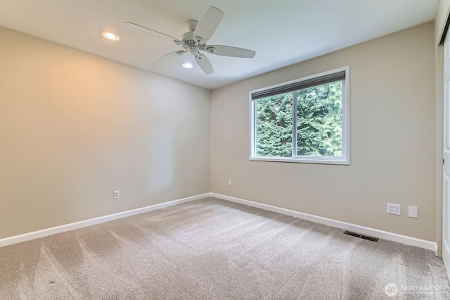 14111 NE 63rd Ct, Redmond, WA 98052 - empty room featuring light carpet, a ceiling fan, and recessed lighting