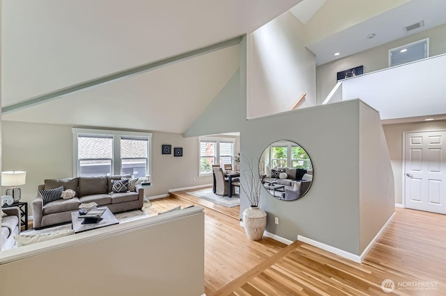 14111 NE 63rd Ct, Redmond, WA 98052 - living area with high vaulted ceiling and light wood-style floors