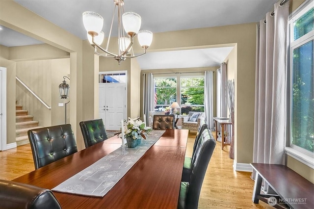 25004 163rd Pl SE, Covington, WA 98042 - dining area featuring a chandelier, stairway, and wood finished floors