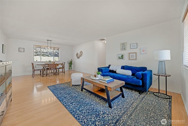 8851 48th Pl W, Mukilteo, WA 98275 - living area with light wood-style floors and a chandelier