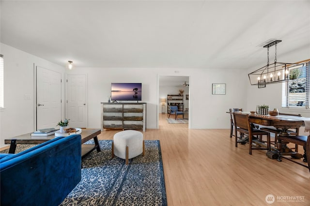 8851 48th Pl W, Mukilteo, WA 98275 - living room featuring light wood-type flooring and a chandelier