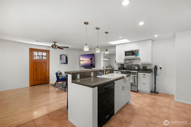 8851 48th Pl W, Mukilteo, WA 98275 - kitchen featuring black appliances, tile counters, white cabinets, ceiling fan, and recessed lighting