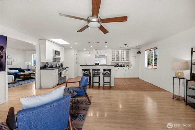8851 48th Pl W, Mukilteo, WA 98275 - living room with a ceiling fan, healthy amount of natural light, light wood finished floors, and recessed lighting