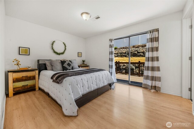 8851 48th Pl W, Mukilteo, WA 98275 - bedroom with light wood-style flooring and access to exterior