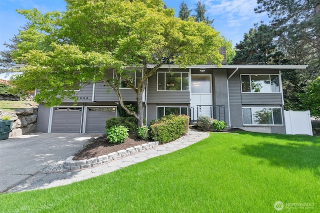2204 139th Pl SE, Bellevue, WA 98005 - split foyer home with asphalt driveway, a front yard, and brick siding