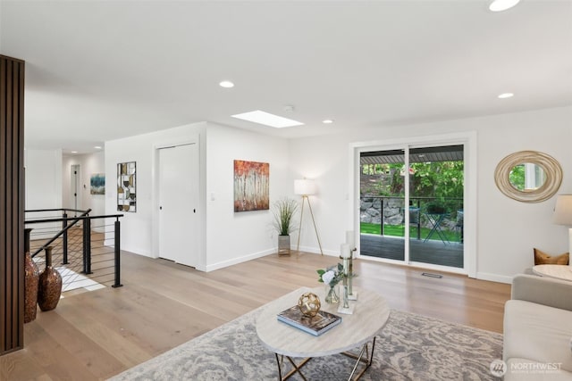 2204 139th Pl SE, Bellevue, WA 98005 - living room with wood finished floors, recessed lighting, and a skylight