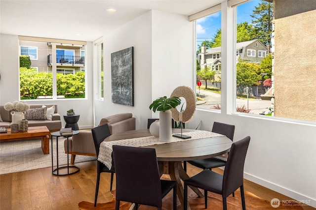 1918 5th Ave N Unit B, Seattle, WA 98109 - dining space featuring hardwood / wood-style flooring and baseboards