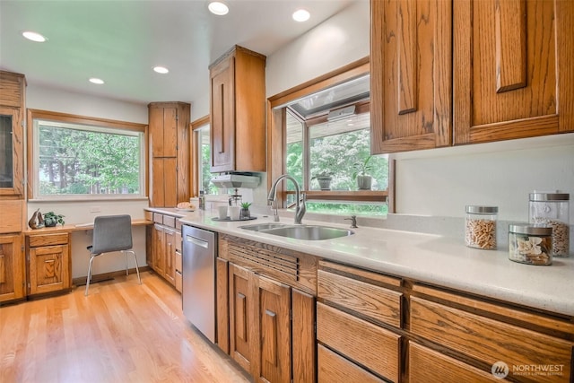 2404 SW 170th St, Burien, WA 98166 - kitchen featuring stainless steel dishwasher, brown cabinetry, light countertops, plenty of natural light, and recessed lighting