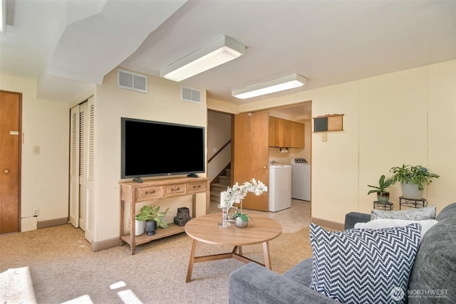 2404 SW 170th St, Burien, WA 98166 - living room featuring washing machine and dryer, stairway, and light carpet