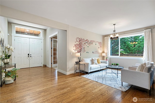 8019 149th Pl SE, Newcastle, WA 98059 - living area featuring wood finished floors and a chandelier