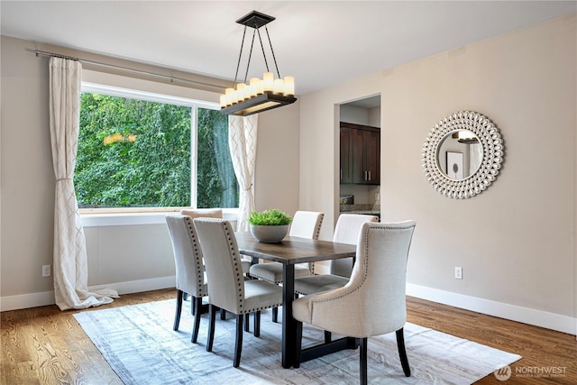 8019 149th Pl SE, Newcastle, WA 98059 - dining space with a chandelier and light wood-style floors